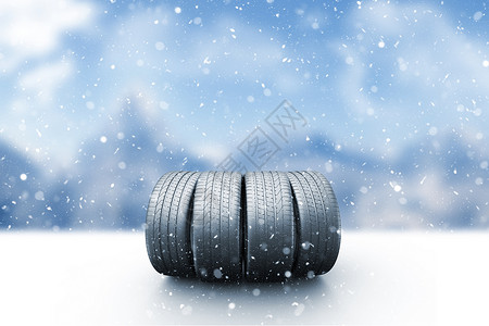 轮缘雪覆盖道路的四辆汽车轮胎背景