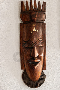 木头雕刻的脸棕色的壁挂式高清图片