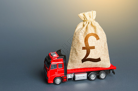 英国经济装着英镑钱袋子的卡车 经济援助 投资和补贴 赔偿 超高收入 缴纳税款 现金收集 汇款和交易 贷款背景