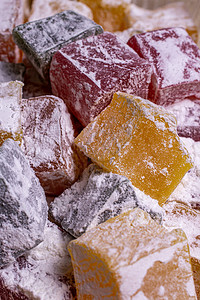 多色土黄色 糖粉加糖的美味食物糖果美食开心果火鸡软糖文化立方体小吃摄影背景图片