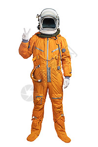 宇航员出舱身穿橙色宇航服和头盔的宇航员在白色背景上显示出手部胜利手势 有手胜利标志的无法认出的宇航员背景