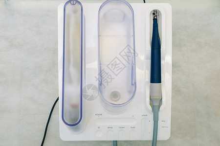 牙科办公室的超声波缩压器 牙科概念打扫手术乐器橡皮诊所矫正超声波卫生机器医生背景图片