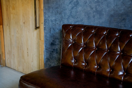 客厅的棕色皮沙发椅长椅织物风格皮革沙发房间椅子装饰家具背景图片