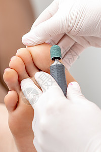 在脚上剥脚修脚程序抛光医生女性剥皮护理病学皮肤表皮身体按摩机器高清图片素材