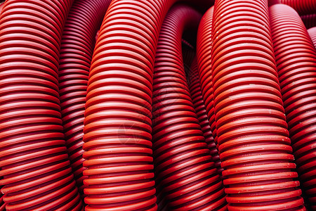 用于地下电线铺设的红花纹pvc管道安装导管电工瓦楞金属材料技术力量灵活性生产背景图片