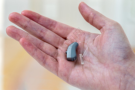 听力障碍听力假说 助听器听筒修复师水平放大器医疗盒子黑色技术假肢援助背景图片