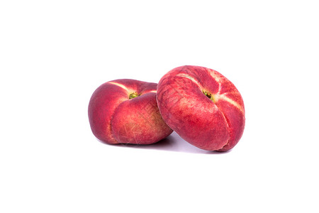 两个桃子两个平的桃子红色水果甜点宏观蔬菜土星白色食物团体热带背景