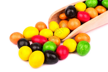 多色糖果甜点白色巧克力黄色食物红色小吃绿色花生橙子背景图片