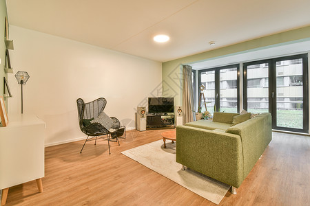 现代公寓中时式的客厅住宅桌子电视家具座位窗帘长椅日光沙发建筑学背景图片
