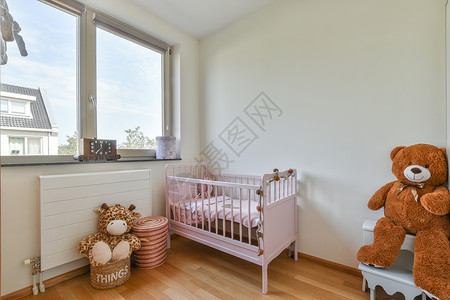 带小床的轻便舒适婴儿房装饰住宅公寓窗户婴儿房子婴儿床财产椅子扶手椅背景图片