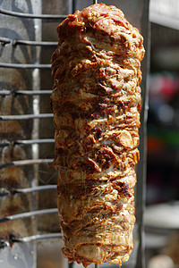 沙瓦玛肉被切开烤箱捐赠者羊肉旋转火鸡食物牛肉街道车削烤肉背景图片