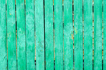 旧木制绿底板 有裂缝和涂料 栅栏 木质纹理背景图片