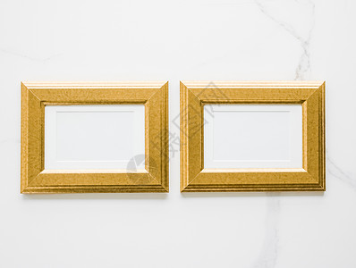 大理石上的金色相框 平面模型  装饰和模型平面概念摄影金子框架房间艺术平铺网店小样奢华印刷品背景图片
