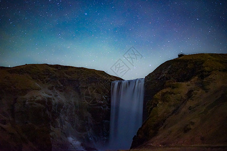 冰岛瀑布滑雪瀑布夜空天文学天空旅游自然现象观光景色星空星星背景图片