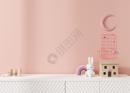 空荡荡的粉红色墙壁 以现代风格模拟儿童房内部 特写视图 为您的图片或其他小物件免费复制空间 餐具柜 玩具 3D 渲染 儿童房模型背景