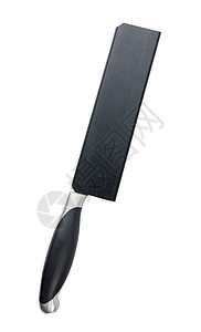 黑色刀在白色背景上被隔离的塑料胶囊中的大厨房刀背景