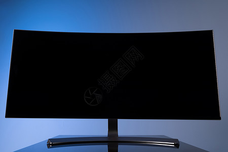电视显示器以灰蓝色背景封闭式灰蓝色上复制空间的大型宽屏幕曲线显示器背景