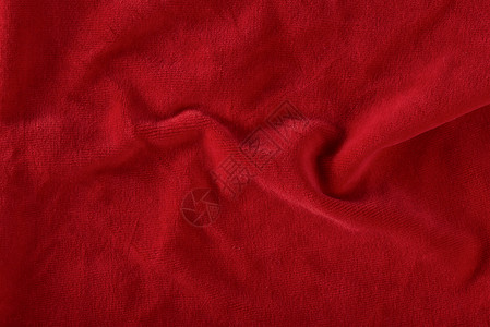 用于明信片或设计背景的红色天鹅绒纹理 圣诞节主题或情人节的红色背景 高质量 大幅面 披覆的红色天鹅绒的抽象纹理羊毛艺术材料墙纸格背景图片