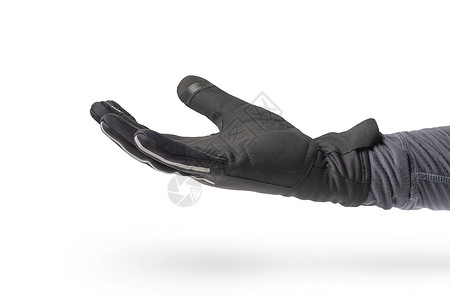 交上骑自行车的人或骑摩托车的人的手套 手放在白色背景中突显的黑色手套中 手掌朝上背景