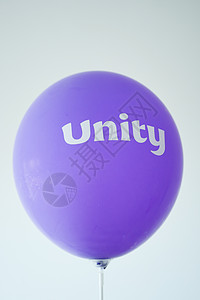 紫色球上的整齐文字团结圆圈团队联盟力量背景图片