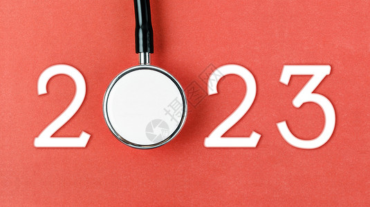红背景2023号的听诊器 新年健康快乐 日历覆盖也愉快疗法横幅水平医学幸福医疗数字问候考试派对背景图片