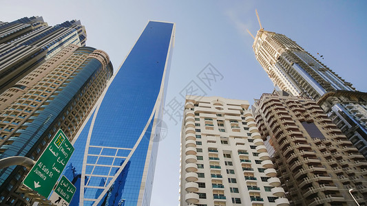 公主塔在阳光明媚的一天 迪拜高塔和现代摩天大楼日落奢华公主天空市中心街道旅游商业天际城市背景