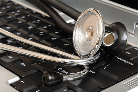 键盘上的立體镜工具笔记本电脑技术医生考试药品病人医疗背景图片
