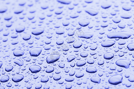 蓝滴雨水水分水滴圆圈金属宏观飞溅口渴液体雨滴背景图片