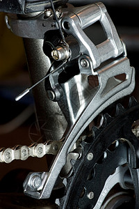 MTB 前出轨器骑术金属链环机器车轮宏观牙盘链轮牙齿磁带背景图片