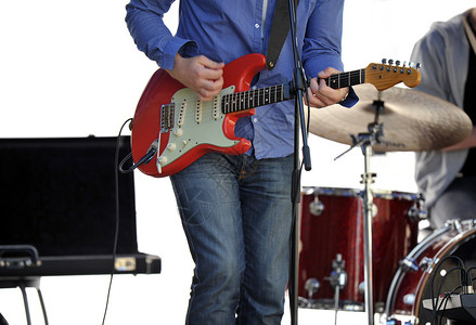 电鼓吉他玩家电缆放大器铙钹腰带架子牛仔裤岩石细绳带子韵律背景