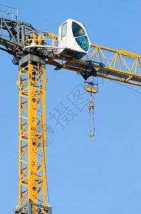 建筑起重机工作职场机器技术商业金属天空生长框架黄色背景图片