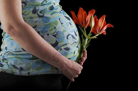 怀孕妇女婴儿手臂女性生活腹部孩子女士身体背景图片