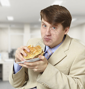 吃汉堡包男性白色的高清图片