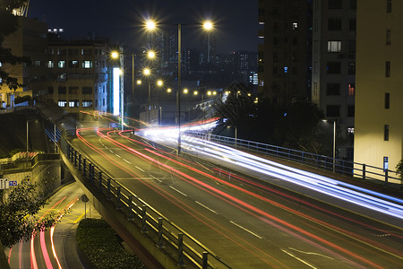 夜间交通桥建筑运动景观速度公共汽车辉光城市戏剧性运输市中心背景图片