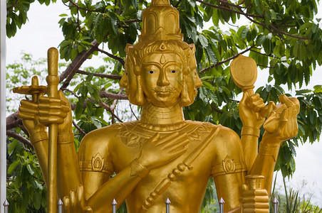 布拉马三位一体仪式神社情调金子冥想宗教雕刻品雕塑奉献背景图片