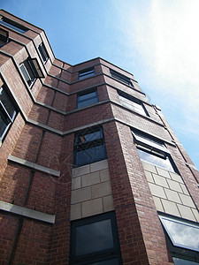 砖砖建公寓蓝色天空办公室建筑学棕色砖块背景图片