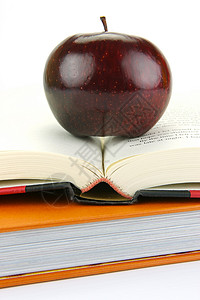 书上苹果红色图书教师教育学校学生概念水果学习老师背景图片