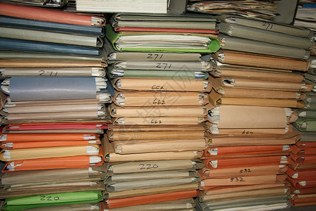 档案文件堆叠棕色纸板行政文件夹组织记录工作文书办公室纸盒背景图片