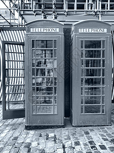 伦敦电话箱王国电话黑色盒子白色地标英语红色背景图片