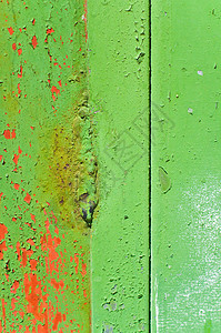 抽象油漆背景绿色划痕裂缝橙子金属背景图片