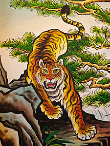 老虎设计素材墙上的老虎雕塑文化信仰木材动物神话旅行雕刻节日建筑学金子背景