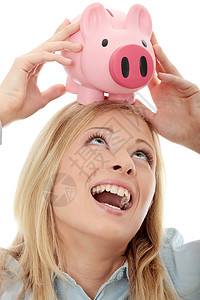 每日一笑拥有小猪银行的女商务人士银行业小猪银行金发女郎商业安全快乐女性女孩金融背景