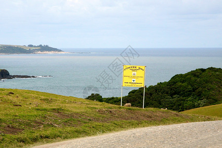 转角海岸线太阳绿色海景波浪风景蓝色转运天堂咖啡海洋背景图片