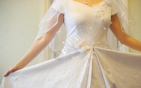 婚纱服装已婚女士新娘裙子宏观美丽女性材料仪式婚礼背景图片