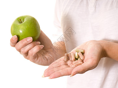 苹果和维生素营养减肥健康饮食绿色生产胶囊食物药片体重背景图片