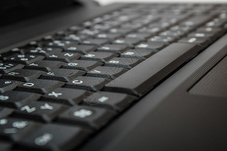 带有计算机键盘的堆叠背景电脑办公室成功技术公司蓝色桌子笔记本硬件按钮背景图片