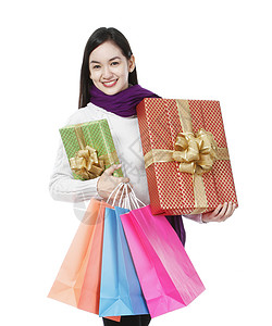 假日机购物购物者衣服购物袋享受女性衣物店铺圣诞礼物快乐背景图片