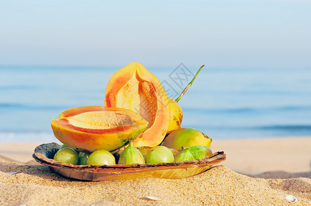 海滩水果新鲜水果养分晴天情调可可食物异国天堂旅行海岸坚果背景