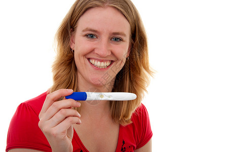 怀有怀孕滋味的女人笑着测试女性检查阅读女士生育力微笑成人背景图片