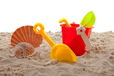 海滩的压浆玩具贝壳游戏塑料闲暇孩子们假期沙坑时间生态背景图片